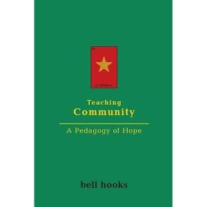 Book cover for bell hooks' Teaching Community. The book cover is entirely green with the title in yellow